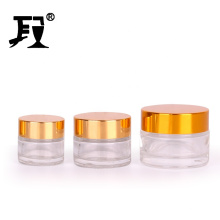 Stocked ecofriendly 10ml 20ml 30ml clear round glass cosmetic cream jar container with golden screw lid